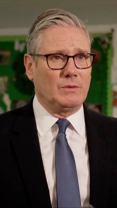 Keir Starmer wearing a suit and a tie 