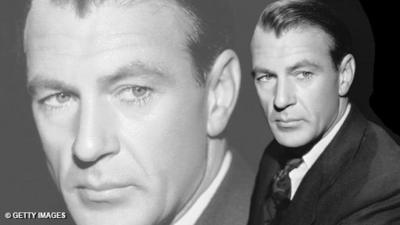 Black and white headshot of Gary Cooper on the right hand of the image, dressed in suit and tie and looking into the distance.  On the right hand side of the image, there is a faded enlargement of the same image