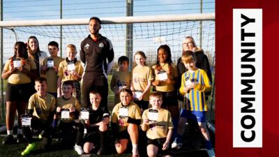 Newcastle's Lloyd Kelly with local schoolkids