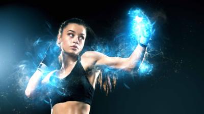 A female boxer throws a jab with magical blue light emanating from her gloves