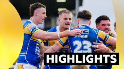 Leeds players celebrate a try against Wigan