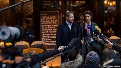 Audrey Bily (R) and Romain Debray, managers of the bar "A la Bonne Biere", deliver a press conference in front of the cafe in Paris on December 4, 2015