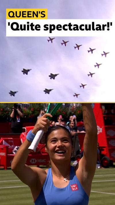 Emma Raducanu smiling and looking up at Red Arrows planes