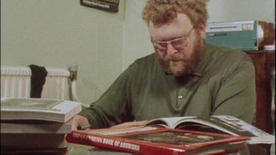 Paddy 'Quiz' Doherty looks through some books to find quiz questions