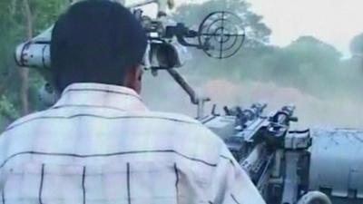 rear view of man driving tank in Sri Lanka