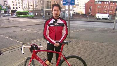 Cyclist outside BBC Nottingham