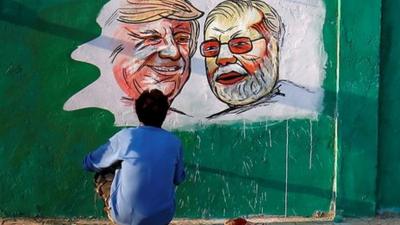 President Trump and PM Modi's face painted on a wall