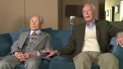 Sir Harold Atcherley & Mikio Kinoshita sat side-by-side.