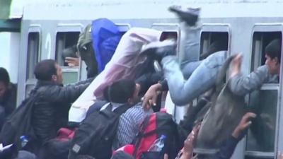 Migrants scrambling to get on board train in Tovarnik Croatia