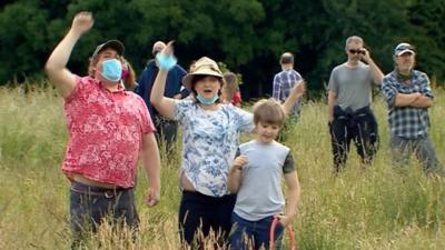 Protesters say they are not against the new hospital but do not want it built on the green open land.