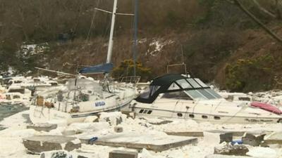 Damaged boats and debris