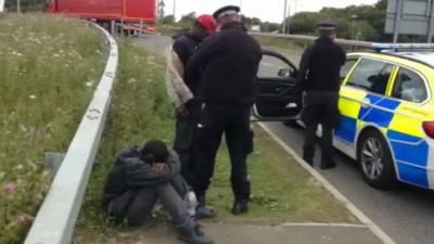 Police intercept migrants who have crossed into the UK