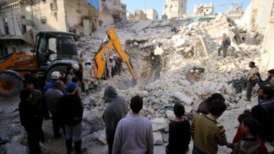 Civil defence members search for survivors after airstrikes by pro-Syrian government forces