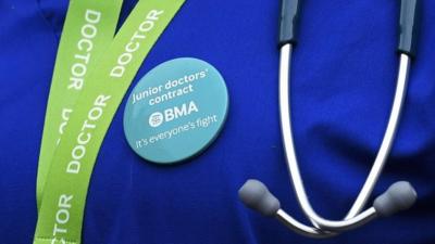 Junior doctor wearing protest badge