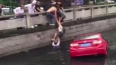 Woman pulled from car in China