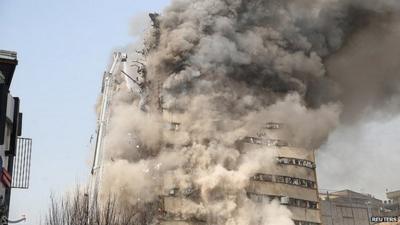 Firefighters battle blaze in Plasco building in Tehran, Iran, shortly before it collapses