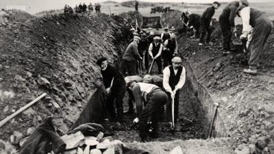 Graves are dug on Islay