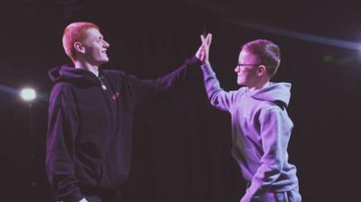 two-young-dancers-high-five