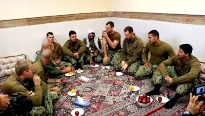 A handout picture made available by the official website of Iranian Revolutionary Guard Corps shows captured US military personnel at an undisclosed location in Iran