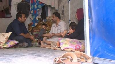 Iraqi displaced living in a tent in a Baghdad camp