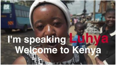 Woman in Kenya with text on top saying 'I'm speaking Luhya - Welcome to Kenya'