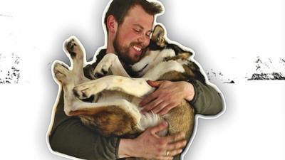 Audun cuddling husky