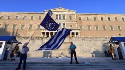 Flags waved outside parliament in Greece