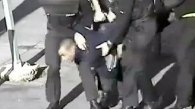 Leon Briggs carried by police