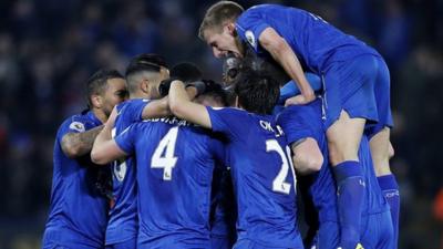 Leicester players celebrate victory over Liverpool