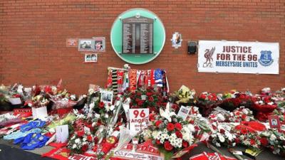 Floral tributes left outside Anfield Stadium