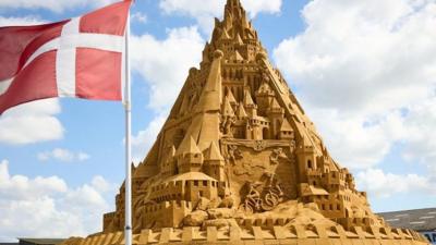 Sandcastle and the Danish flag