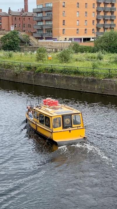 A water taxi boat on the river
