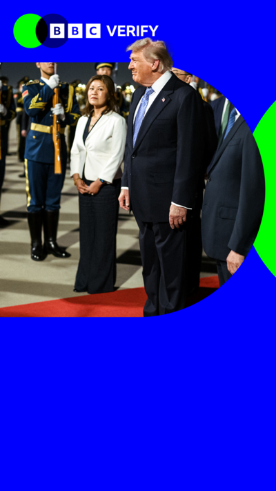 Trump standing next to military men 
