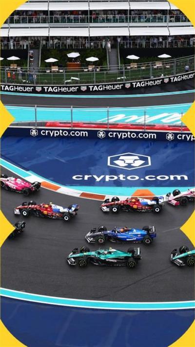 Formula 1 cars drive around a race track with blue borders
