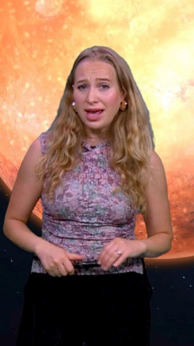 Sophia Herod standing in front of an image of Mars