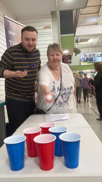 Joe McGrath at Ashton Market quizzing people on the responsibilites of the mayor 