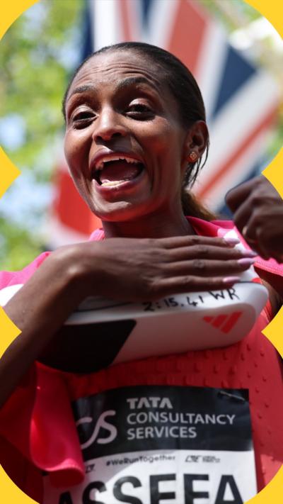 Assefa smiles into the camera after winning the London Marathon.