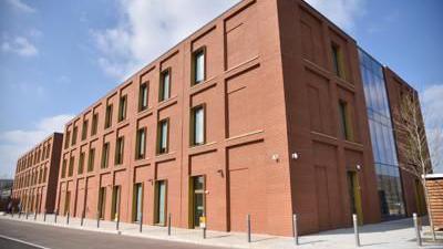 Sand Martin House: a rectangular red brick building with glass windows. 