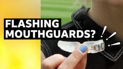 Clear mouthguard held up to camera