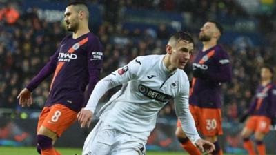 Bersant Celina runs to celebrate his goal against Manchester City