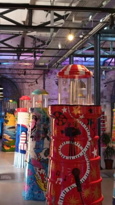 A picture of the lighthouse sculptures within a large hall.