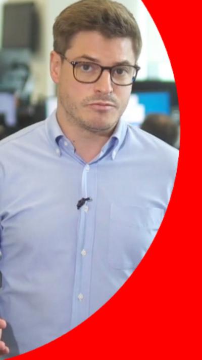 BBC journalist Nick Marsh has short brown hair and is wearing glasses and a blue shirt.