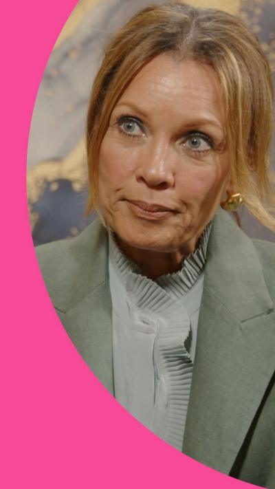 Vanessa Williams, wearing a pale green suit with light brown hair tied back, in front of a BBC Sounds microphone.