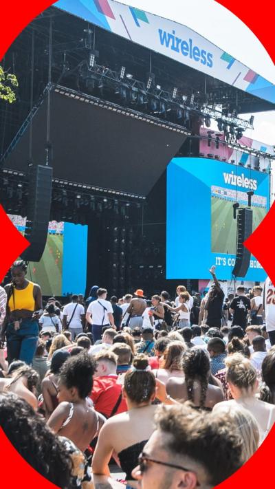 Crowds of people stand in front of a stage at a previous Wireless Festival.