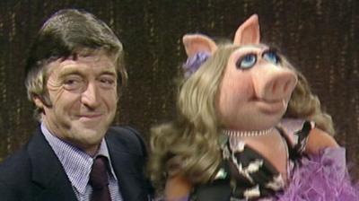 Michael Parkinson with the muppet, Miss Piggy.