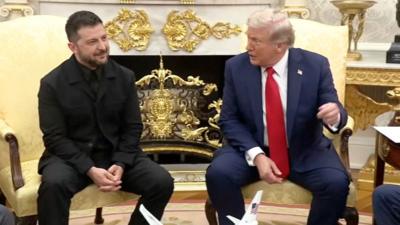 Zelensky and Trump sit together in the Oval Office
