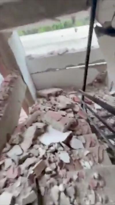 An image showing rubble which is covering a stairwell in a building