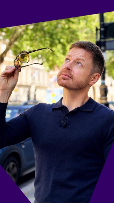 Thomas Schafernaker looks up to the sky as he takes his sunglasses off.