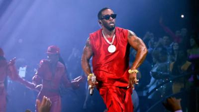Sean Diddy Combs wearing red and big gold chain, Diddy performs onstage during the 2023 MTV Video Music Awards