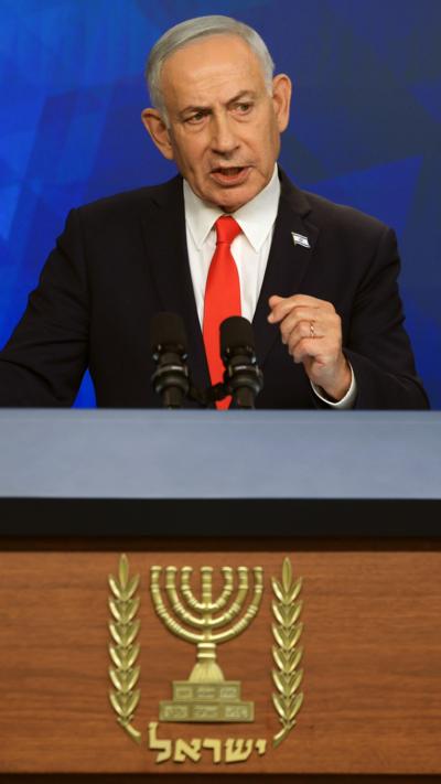 Netanyahu standing at a podium